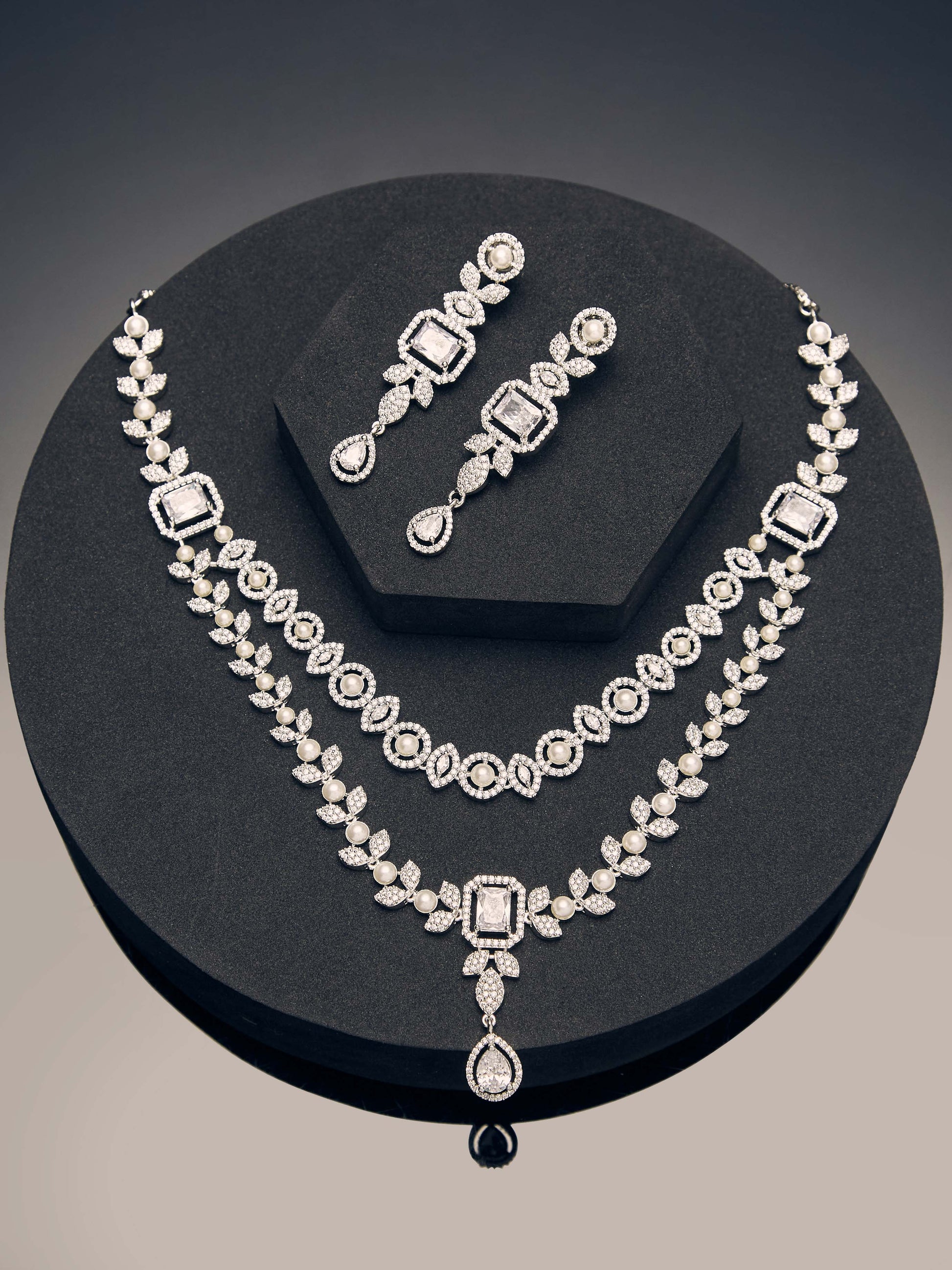 white CZ double layered diamond necklace set with rhodium finish and elegant drop earrings