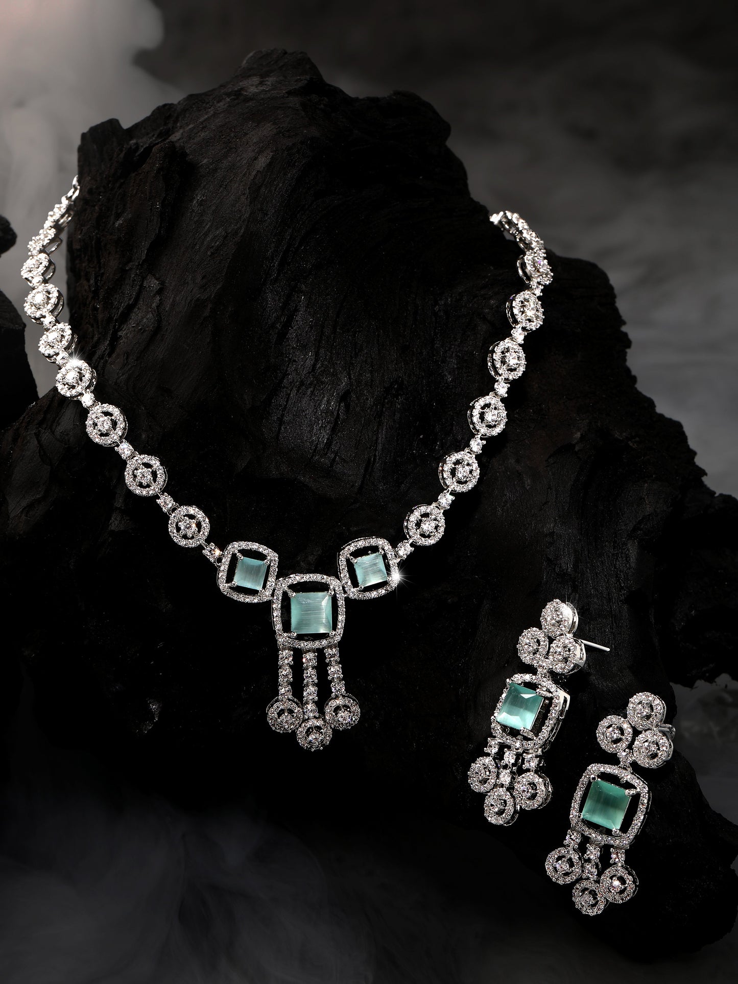Rhodium-plated statement jewellery set with sea green square stones and white American diamonds