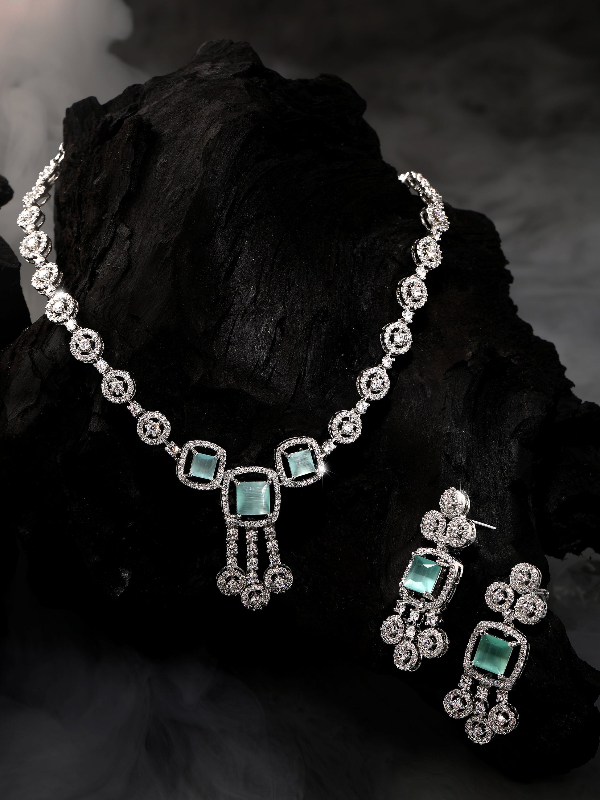 Rhodium-plated statement jewellery set with sea green square stones and white American diamonds