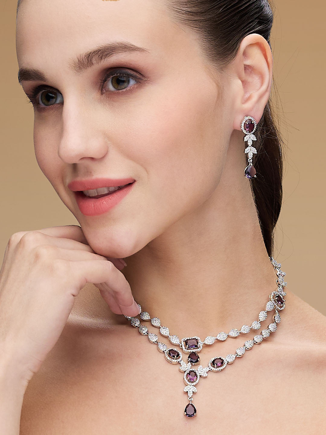 rhodium-plated double-layered necklace set with purple and white CZ stones and matching drop earrings