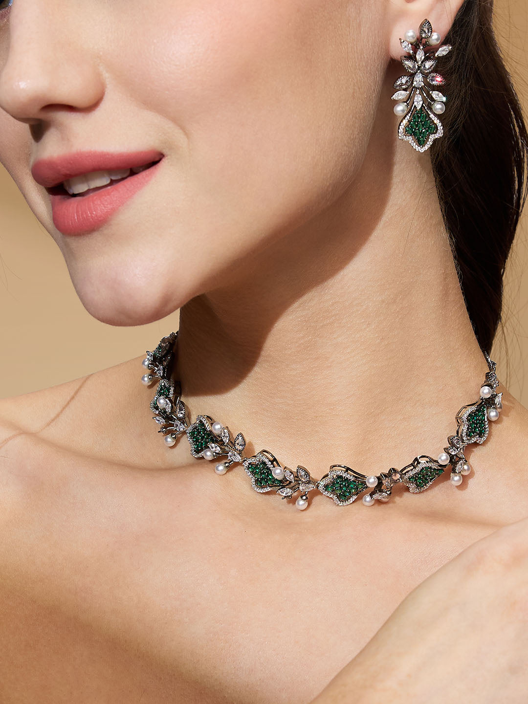 Black-plated diamond and pearl choker set with green cubic zirconia stones and drop earrings
